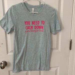 Light blue t-shirt with Taylor Swift lyrics